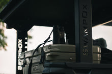 Load image into Gallery viewer, Closeup side view of UTV featuring Swamp Ox hood rack in outdoor setting during the day. Black textured powder-coated bed rack carrying outdoor gear.